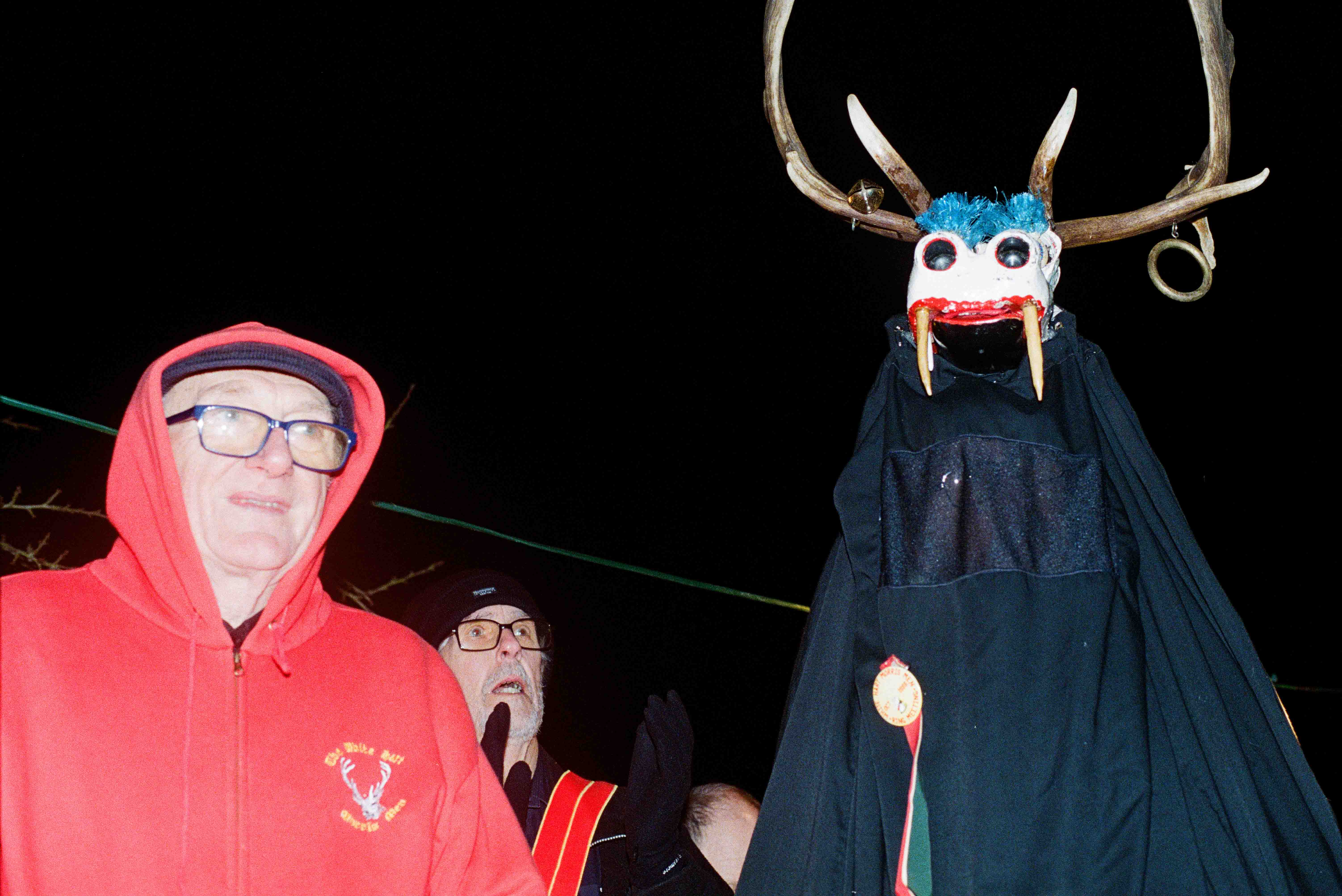 Shocked old men in the dark