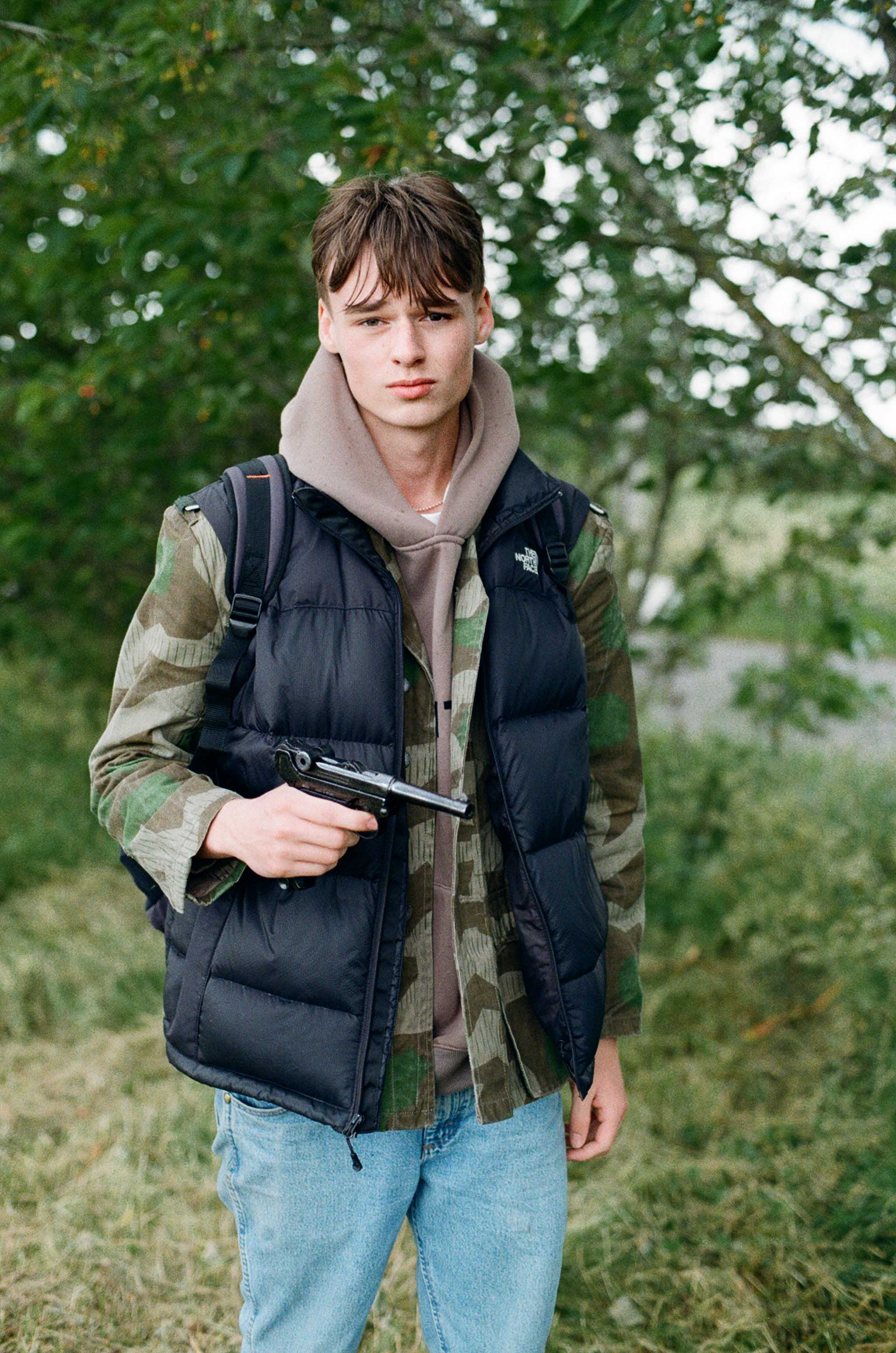 Teenage boy holding a Mause C96